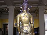 British Museum Top 20 Buddhism 09-2 Standing Avalokiteshvara Back Standing Avalokiteshvara  Nepal, 16C AD, 138cm high. Here is a view from behind Avalokiteshvara. This very large image was made in gilded bronze in several pieces. Rivets above the waist and above the elbows hold the figure together.